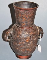 Lot 61 - A Chinese bronze vase having tapering neck to...
