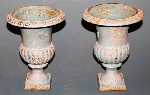 Lot 66 - A pair of miniature cast iron urns of campagna...