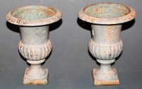 Lot 66 - A pair of miniature cast iron urns of campagna...