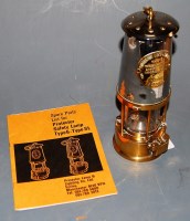 Lot 100 - A chrome plated and brass miner's safety lamp...
