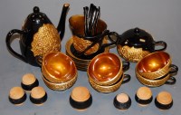 Lot 115 - A Japanese black lacquered and gilt decorated...
