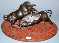 Lot 137 - A bronze figure group of two bulls in fighting...