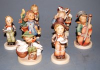 Lot 214 - Eight various Hummel figures, to include...