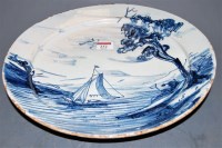Lot 232 - An 18th century Liverpool Delft charger,...