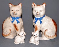 Lot 236 - A pair of pottery cats, with sponged...