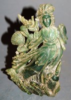 Lot 244 - A Chinese carved green quartz figure of Guanyin