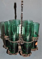 Lot 263 - A wrought metal liqueur stand with six green...