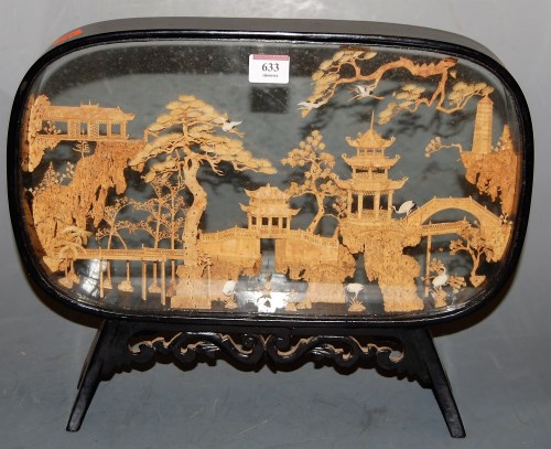 Lot 633 - A Chinese cork carving depicting pagodas and...