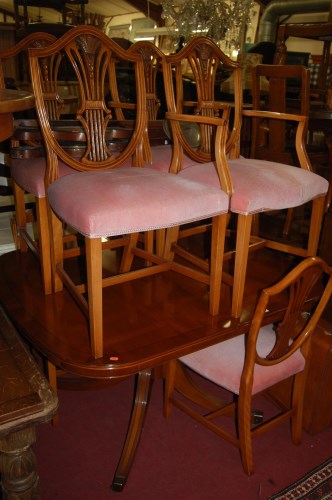Lot 1388 - A reproduction yew wood dining suite,...