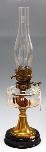 Lot 5 - An early 20th century brass pedestal oil lamp,...