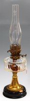 Lot 5 - An early 20th century brass pedestal oil lamp,...