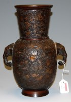 Lot 7 - A Chinese bronze vase having tapering neck to...