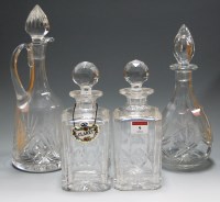 Lot 9 - A near-pair of Stuart cut crystal decanters...