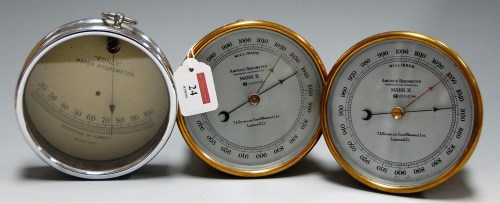 Lot 24 - A pair of brass cased aneroid barometers, MkII,...
