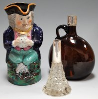 Lot 41 - A Staffordshire toby jug with typical triform...