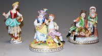Lot 197 - A pair of Dresden porcelain figure groups, one...