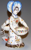 Lot 205 - A French Faience figural table salt, 19cm
