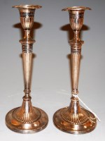 Lot 233 - A pair of Edwardian silver candlesticks on...