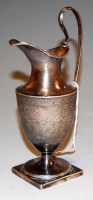 Lot 243 - A George III silver helmet form cream jug,...