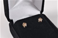 Lot 2501 - A pair of fancy coloured diamond earstuds, the...
