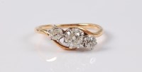 Lot 2505 - A three stone diamond ring, the three...