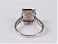 Lot 2518 - A 9ct smokey quartz and diamond ring, the...