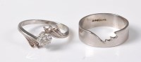 Lot 2528 - A diamond ring and matching wedding band, the...