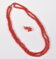 Lot 2531 - A coral choker and a carved coral elephant...