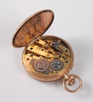 Lot 2533 - A '14k' open faced pocket watch, with black...