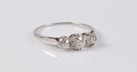 Lot 2536 - A three stone diamond ring, the three...