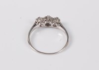 Lot 2536 - A three stone diamond ring, the three...