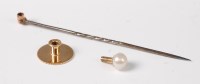 Lot 2541 - Four stick pins: a 5.7mm off-round 'pearl'...
