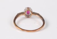 Lot 2544 - A treated ruby and diamond ring, the oval...