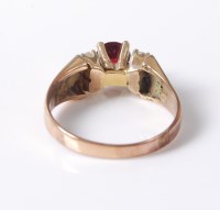 Lot 2547 - A synthetic ruby and diamond ring, the round...