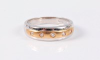 Lot 2555 - An 18ct diamond ring, the central yellow gold...