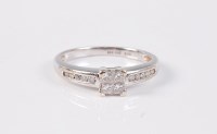 Lot 2561 - An '18k' diamond ring, four central princess...