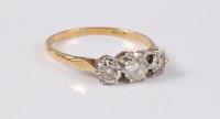 Lot 2562 - An 18ct three stone diamond ring, the three...
