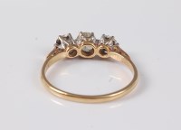 Lot 2562 - An 18ct three stone diamond ring, the three...