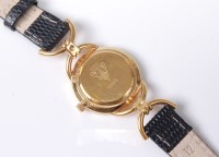 Lot 2567 - A lady's Gucci dress watch, the round black...