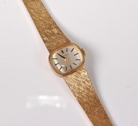 Lot 2569 - A lady's 9ct Bulova wristwatch, the oval...