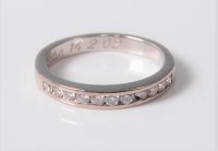 Lot 2576 - A 14ct diamond half hoop ring, the single...