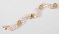 Lot 2583 - An '18k' cultured pearl and diamond bracelet,...