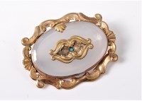 Lot 2596 - A chalcedony and turquoise brooch, the oval...
