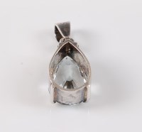 Lot 2597 - A topaz pendant, the pear shaped pendant...