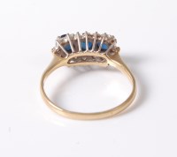Lot 2604 - An 18ct sapphire and diamond ring, the three...