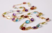 Lot 2609 - A multi gem set necklace, the oval faceted...