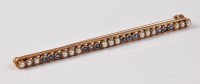 Lot 2616 - A 15ct sapphire and pearl bar brooch,...