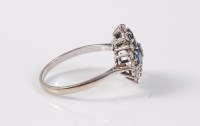 Lot 2619 - A sapphire and diamond ring, the central round...