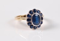 Lot 2620 - A sapphire cluster ring, the central oval...