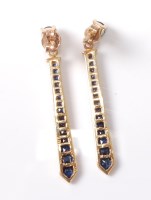 Lot 2623 - A pair of 18ct sapphire earrings, the...